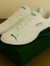 Puma Lightweight White Sneakers with Green Heel Design
